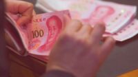 kurs yuan dan dollar